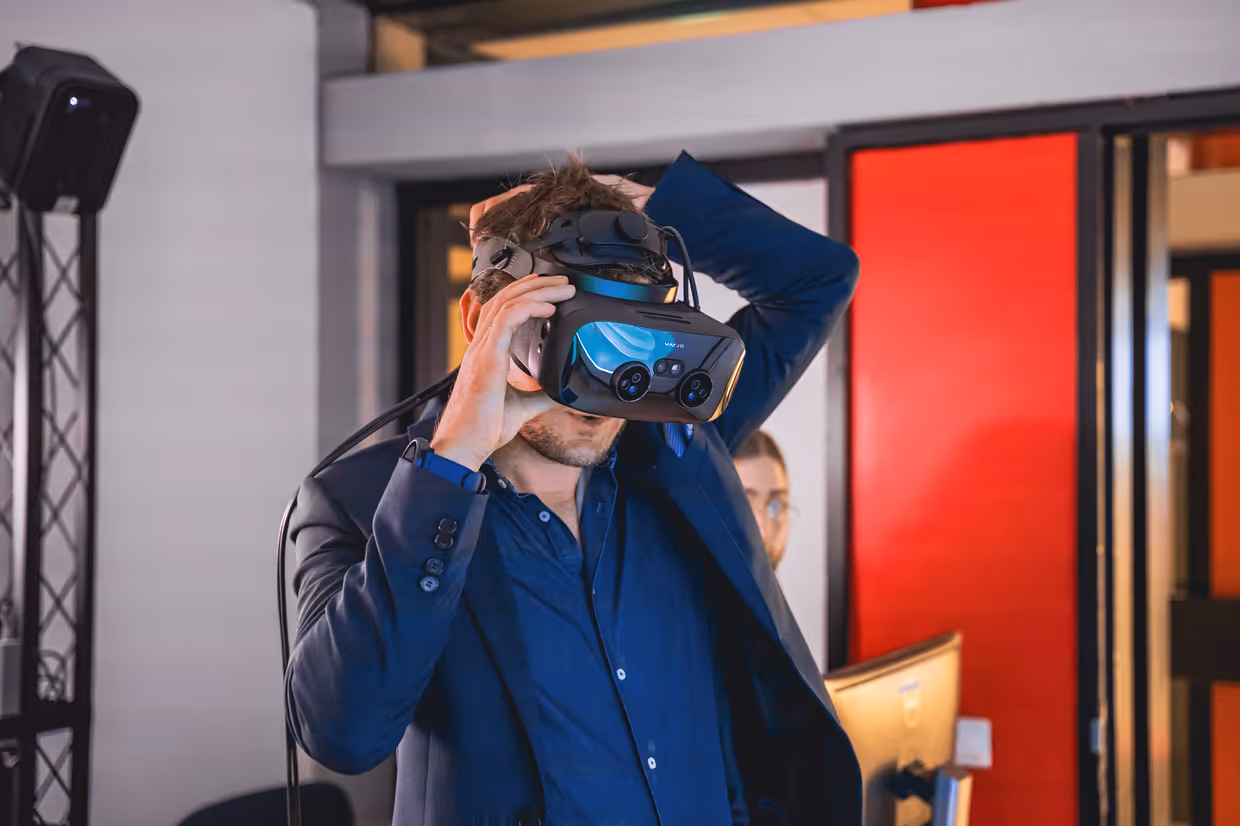Researcher putting on VR glasses.