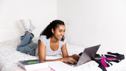Student behind her laptop