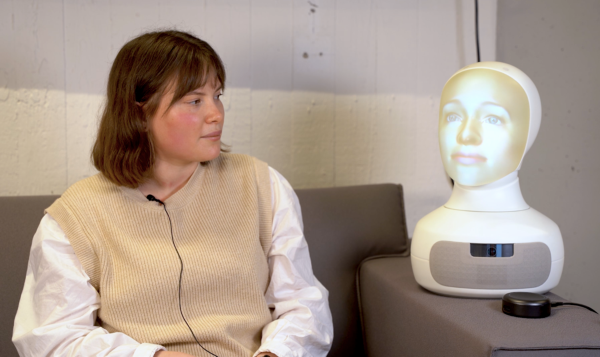 A person having a conversation with the social robot.