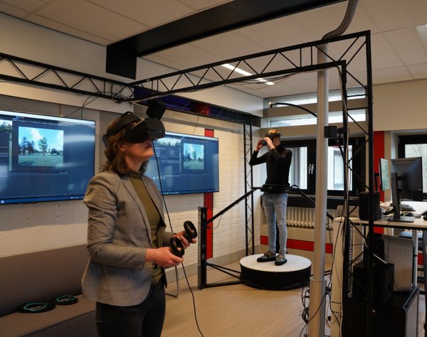 The XR Lab (ManouVR) with two people using VR.