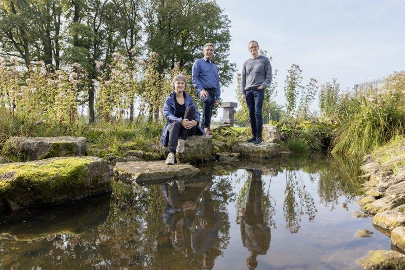 Wijnberg, Augustijn and Berger posing near water
