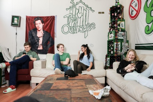 Housemates of a student house in Enschede chill on their couches together.