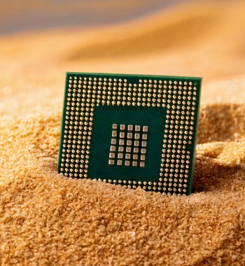 Computer chip in sand