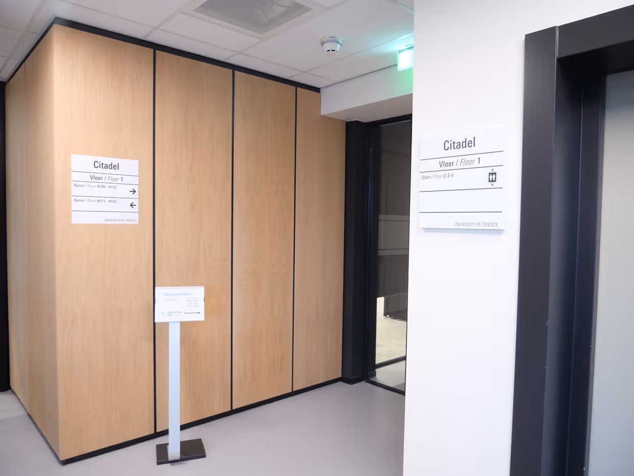 Next to the elevator