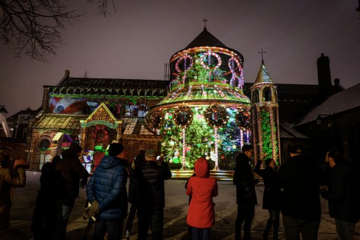 A church lit up with a laser projection.