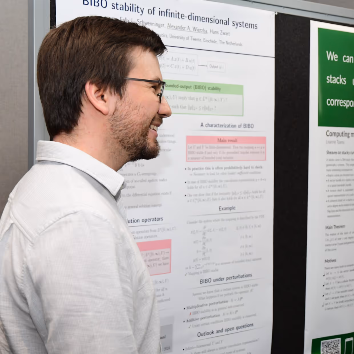 Alexander Wierzba next to his poster