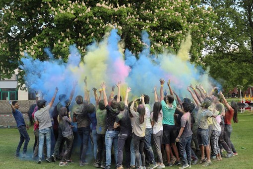 A group of students celebrating the Holi festival.