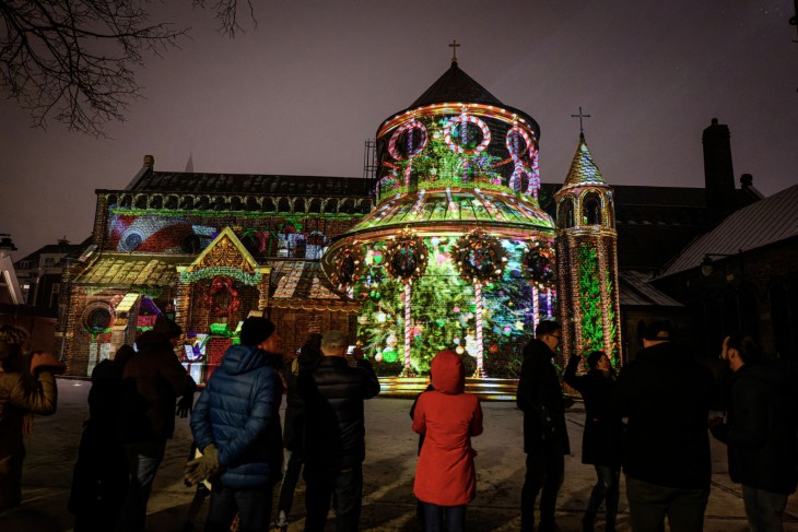 A church lit up with a laser projection.