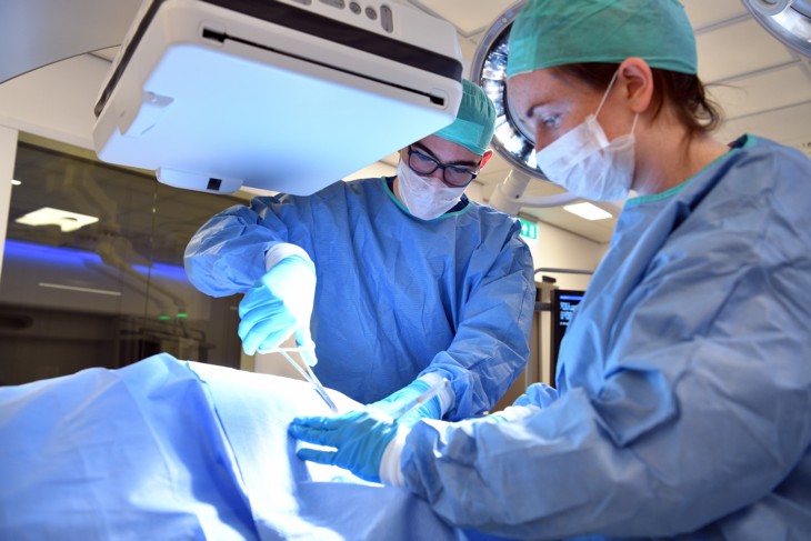 Surgeons performing operation