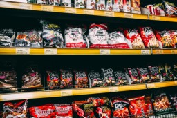 Shelves with snacks in an Asian supermarket.