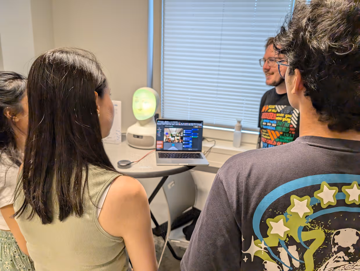 people interacting with the Detox Buddy robot