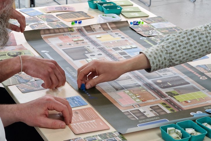 Close-up of the board game Sudsbury 2.0, a game developed for climate awareness and urban planning.