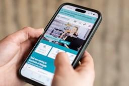 Student looking on a student housing website on their phone