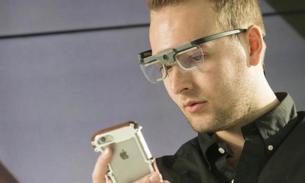 Person using Tobii 2 glasses with a phone.