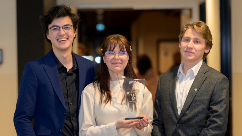 Richard, Diana and Artur smile into the camera.