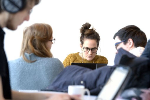 Students studying behind their laptop