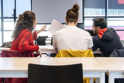 Students sitting in a classroom discussing