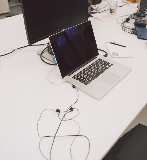 Desktop and laptop screens which are blank.