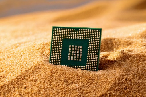 Computer chip in sand